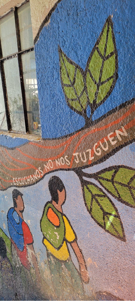 “Listen to us, don't judge us,” says one of the murals painted by migrants in Albergue Tochán, a shelter in Mexico City.