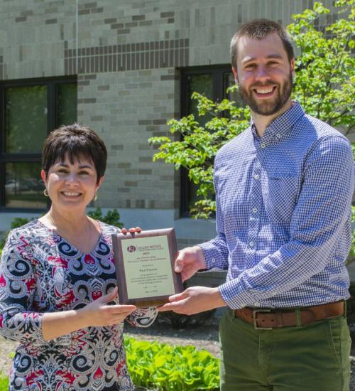 Denise Wright and Paul Friesen Denise Wright presenting Paul Friesen with Graduate Contribution award.