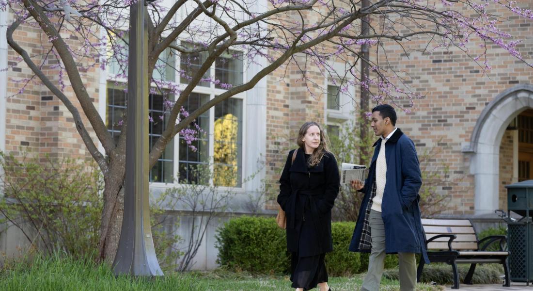 Isa Sheikh and Susan Ostermann walking outside