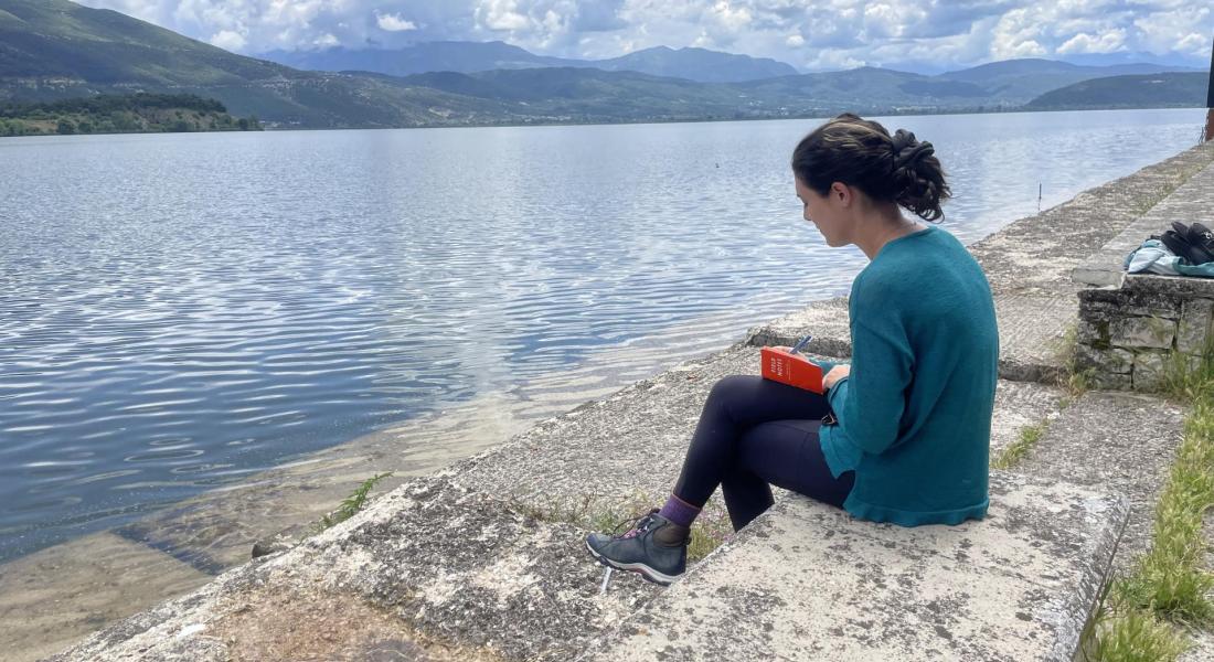 Taking field notes after a cemetery day while overlooking the Lake of Ioannina