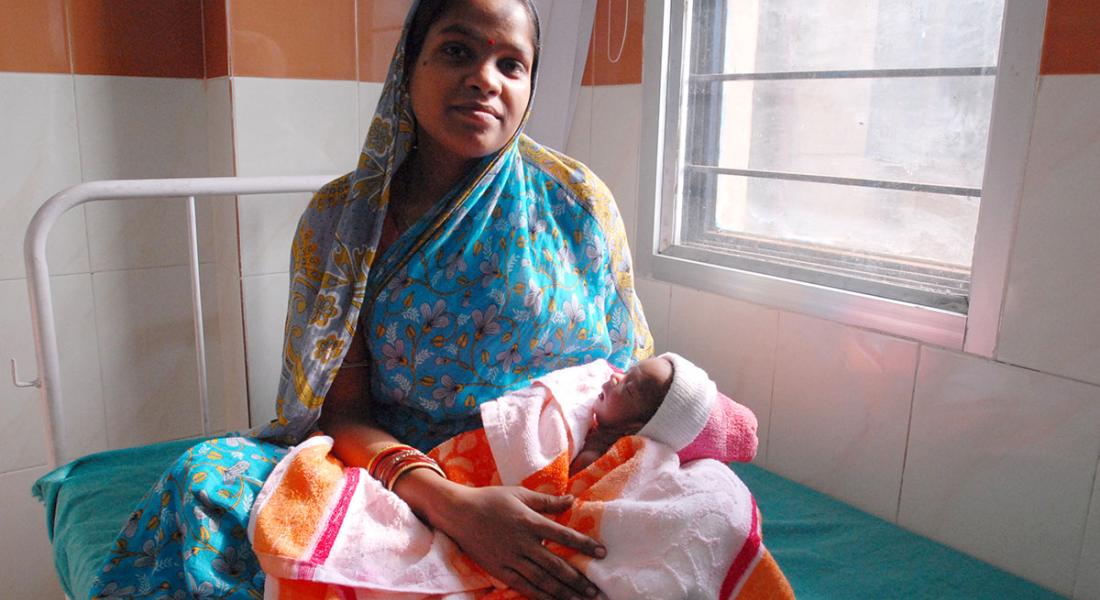 A mother and her newborn child are pictured in Odisha, India