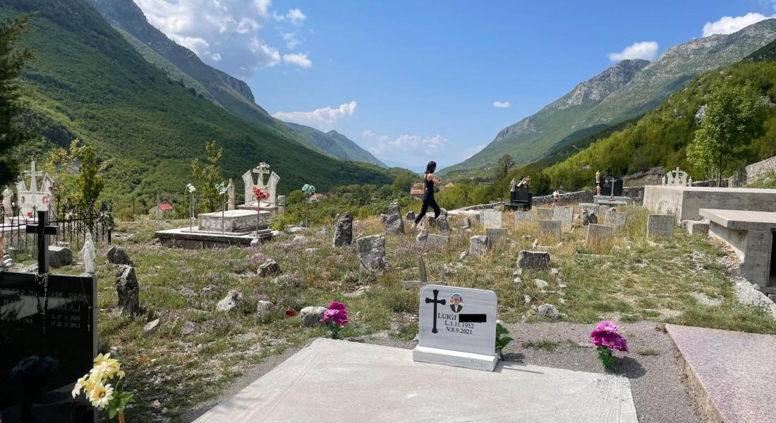 Mary Shiraef visiting cemetery in Albania for graduate research grant.
