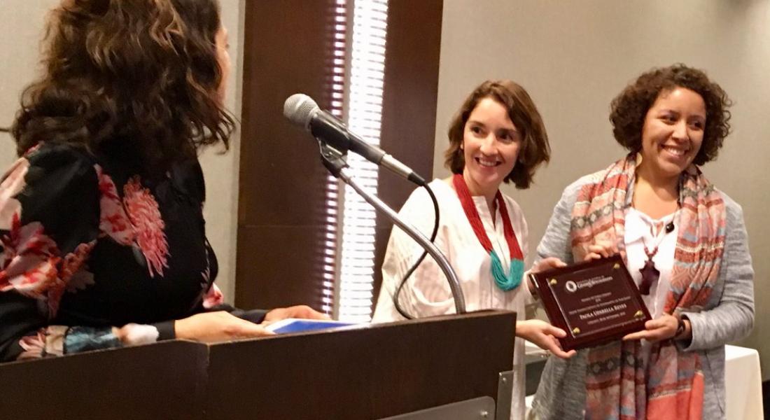 Kellogg Doctoral Affiliate Paola Uparella Accepting Award