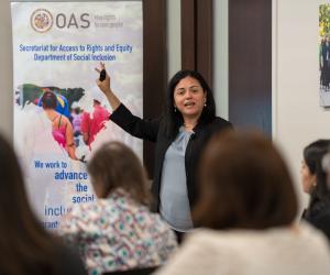 Abby Córdova presents during a training on migration and human rights