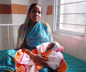 A mother and her newborn child are pictured in Odisha, India